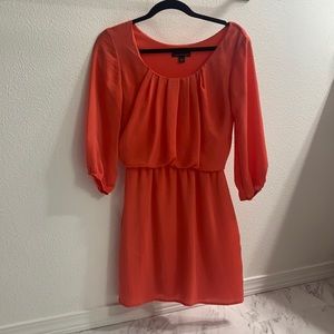 Pretty shade of coral midi dress.